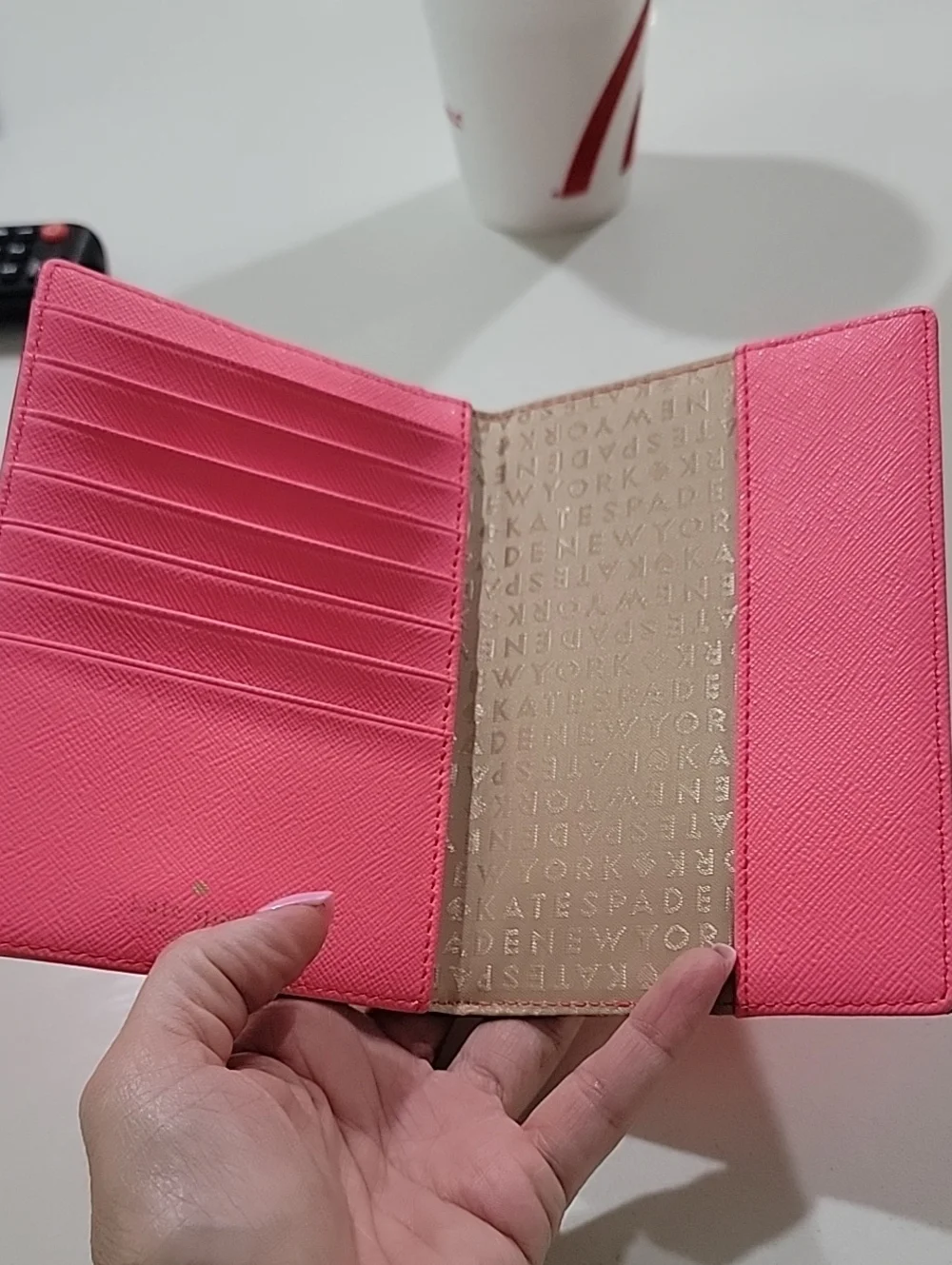 kate spade coral Talk The Talk Imogene Passport Holder Featuring Parrot